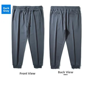 Front and back views of dark gray drawstring joggers with cuffed ankles and side pockets