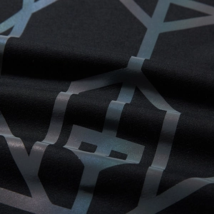 Black oversized hoodie with iridescent reflective geometric print and technical fabric