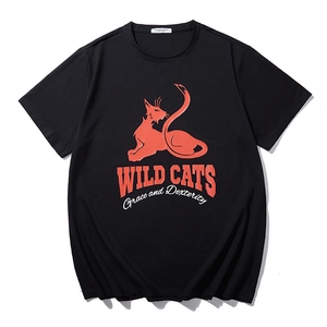 Loose fit black cotton T-shirt featuring a bold orange Wild Cats cartoon print and text