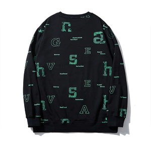 Black crewneck sweatshirt with green all-over letter print in oversized street style