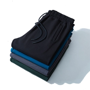 Men's relaxed sports joggers set in four solid colors featuring elastic drawstring waist