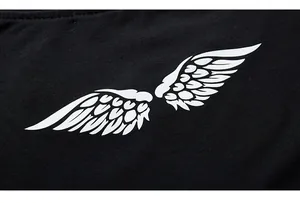 Detail of white symmetric wing print on high-quality black cotton long-sleeve T-shirt