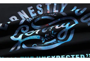 Detail of artistic nebula star pattern print on black cotton long sleeve T-shirt