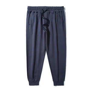 Men's dark grey minimalist drawstring jogger pants with elastic waist and ribbed cuffs