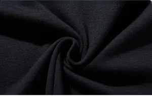Macro shot of high-quality navy blue knitted cotton fabric with fine texture