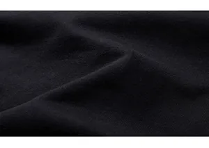 Close-up of premium black cotton sweatshirt fabric showing soft texture and weave