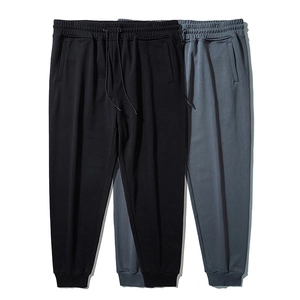 Men's casual loose-fit joggers in black and dark grey with adjustable drawstring waist