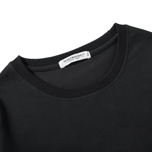 Close-up of black crew neck plus size sweatshirt with 3XL label and ribbed neckline