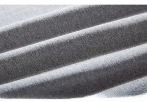 Macro shot of grey knit fabric texture showing soft cotton blend fibers and fine weave