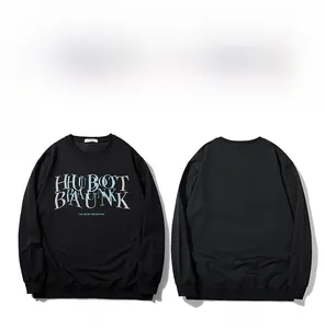 Detailed view of black oversized crewneck sweatshirt with graphic letter prints