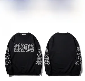 Detail of black crewneck sweatshirt with white Gothic letter printing on chest and sleeves