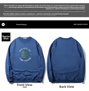 Flat lay of denim blue sweatshirt featuring circular graphic print and ribbed cuffs