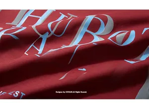 Macro shot of stylish letter printing on red knit fabric with detailed fiber texture