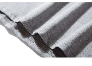 Close-up of gray cotton knit T-shirt hem with professional double-needle stitching