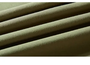 Macro detail of olive green knit fabric texture with soft feel and thick weave for men's T-shirt