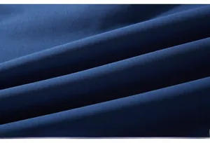 Detail shot of navy blue knit fabric showing tight texture and high-quality finish