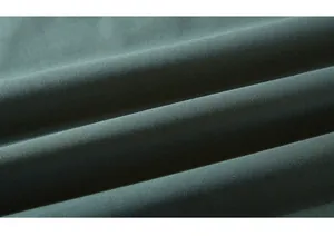 Macro shot of dark green textured hoodie fabric showing premium soft knit details