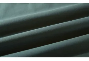 Macro shot of dark green knitted fabric texture and soft folds on a men's hoodie