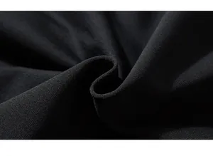 Close-up of premium black knitted fabric showing fine texture and durable cotton material