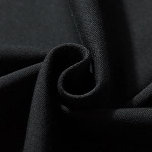 Texture of a black long-sleeved t-shirt in oversized fit featuring premium knit fabric