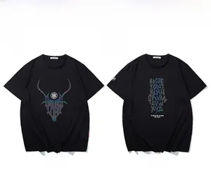 Flat lay of black cotton t-shirts with reflective shield logo and creative letter printing