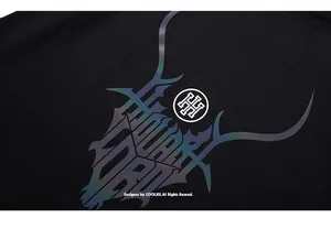 Macro view of iridescent animal horn print and circular logo on black cotton T-shirt