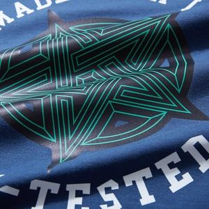 Blue oversized men's hoodie with geometric star print and white MADE lettering