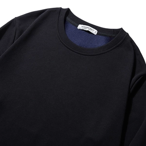 Men's heavyweight fleece sweatshirt in black showing close-up neck detail and logo tag