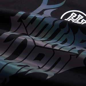 Oversized black cotton T-shirt featuring colorful reflective graphic print and H logo