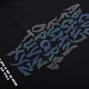 Oversized black cotton T-shirt featuring vibrant reflective laser letter printing