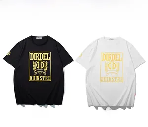 Close-up of gold geometric print with GD logo and lettering on cotton blend T-shirt