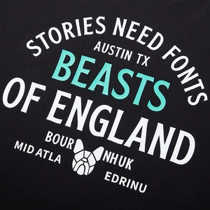 Oversized black cotton T-shirt featuring a beast graphic print and bold lettered typography