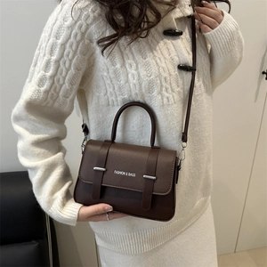 Brown lychee leather crossbody bag for women with FASHION & BAGS print and top handle