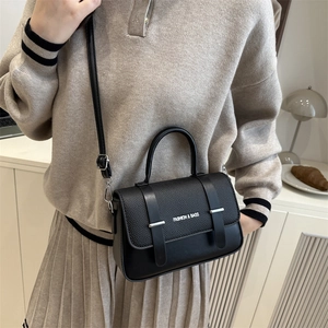 Chic black litchi leather crossbody square bag with silver buckles and a shoulder strap