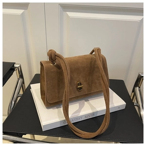 Brown suede underarm bag with vintage gold twist lock and unique knot shoulder strap detail