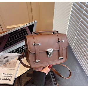 Brown retro PU leather tote bag with silver twist lock and adjustable shoulder strap