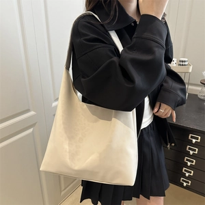 Minimalist cream shoulder tote bag in soft faux leather for autumn fashion trends