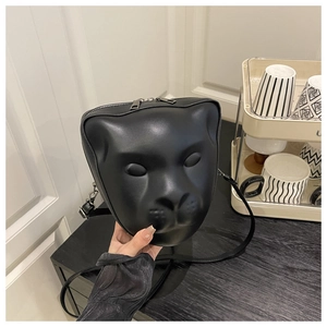 Detail of 3D animal face relief on a matte black square crossbody bag for women