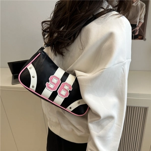 Retro black and white leather hobo bag with pink number 96 and silver metal rivets