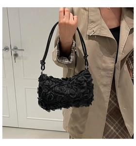 Detail of 3D rose flower shoulder bag featuring layered chiffon petals and slim straps