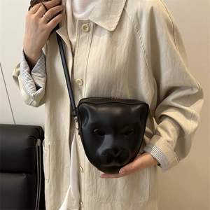 Unique black panther head shaped shoulder bag with glossy finish and minimalist leather strap