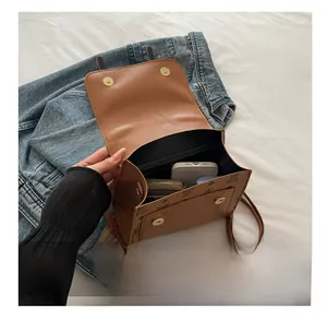 Detail view of the spacious interior of a vintage brown monogrammed mini backpack