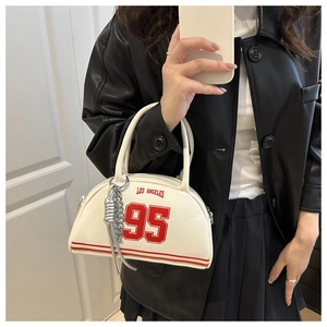 Detail of white semi-circular leather handbag with red Los Angeles 95 print and silver chain