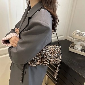 Vintage leopard print shoulder bag with punk metal studs and silver buckle details