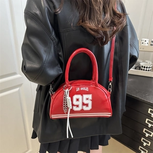 Red Los Angeles 95 crossbody bag with silver chain and sporty stripes in a lifestyle setting