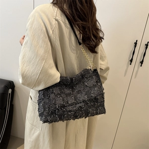 Retro grey textured crossbody bag with gold chain strap and fringed fabric finish