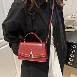 Chic red square shoulder bag with gold V-clasp and top handle for autumn winter fashion