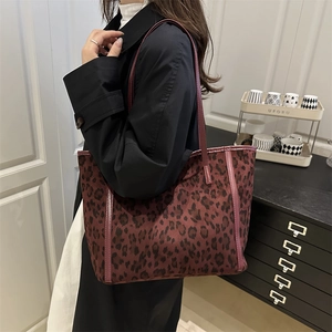 Stylish large leopard print tote bag with leather straps for women in casual autumn style