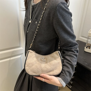 Chic beige quilted shoulder bag with gold-tone chain and minimalist leather texture