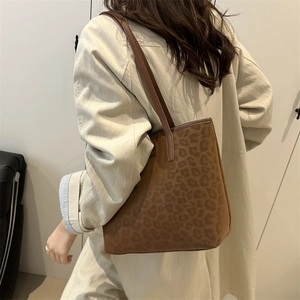 Chic brown leopard print faux leather tote bag with slim shoulder straps in retro style